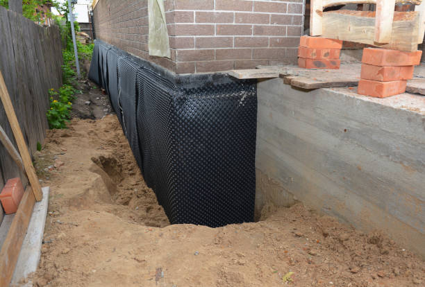 Happy homeowners after waterproofing job in Lena